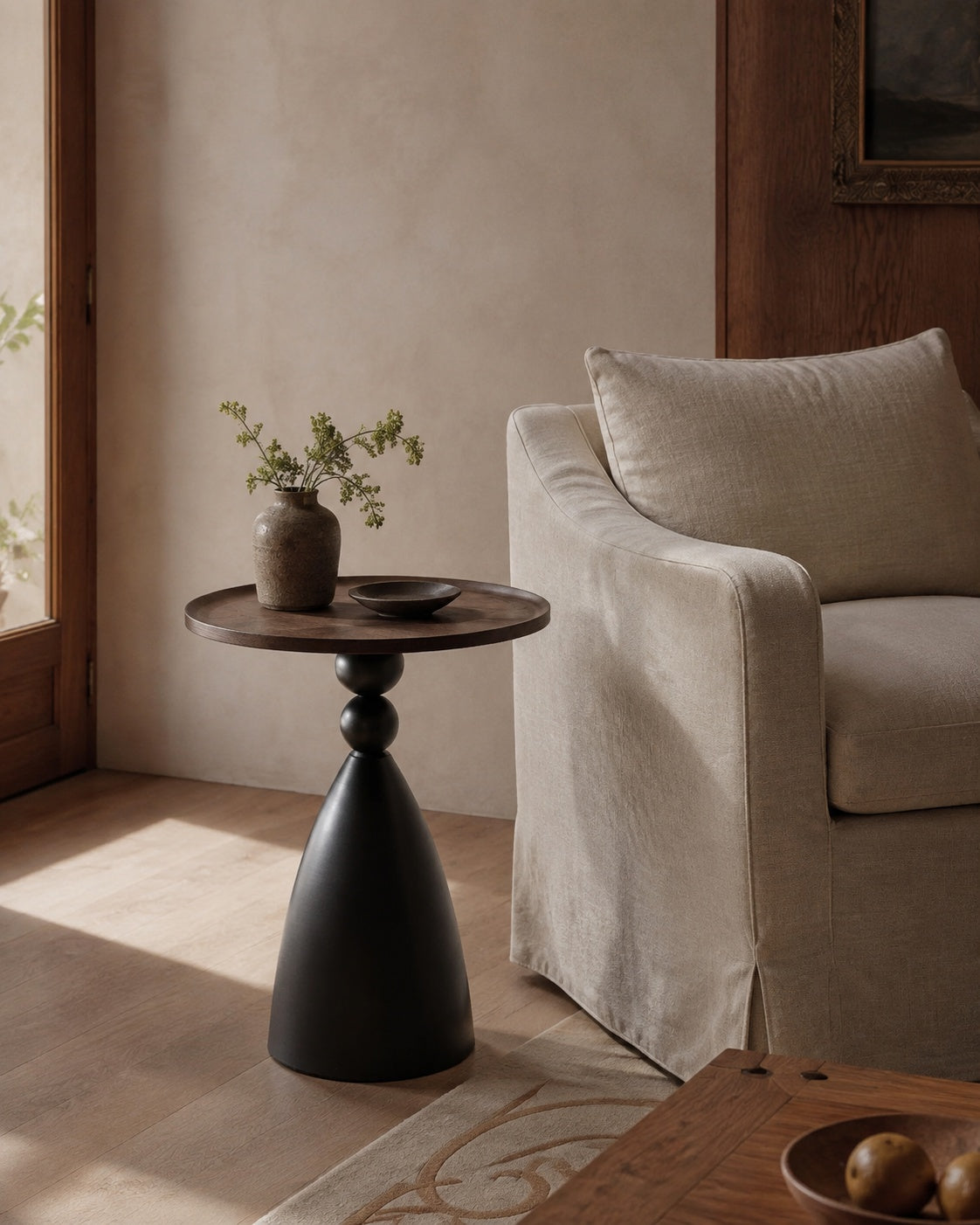 40 cm Recessed Walnut Pedestal Side Table beside a Lounge Chair