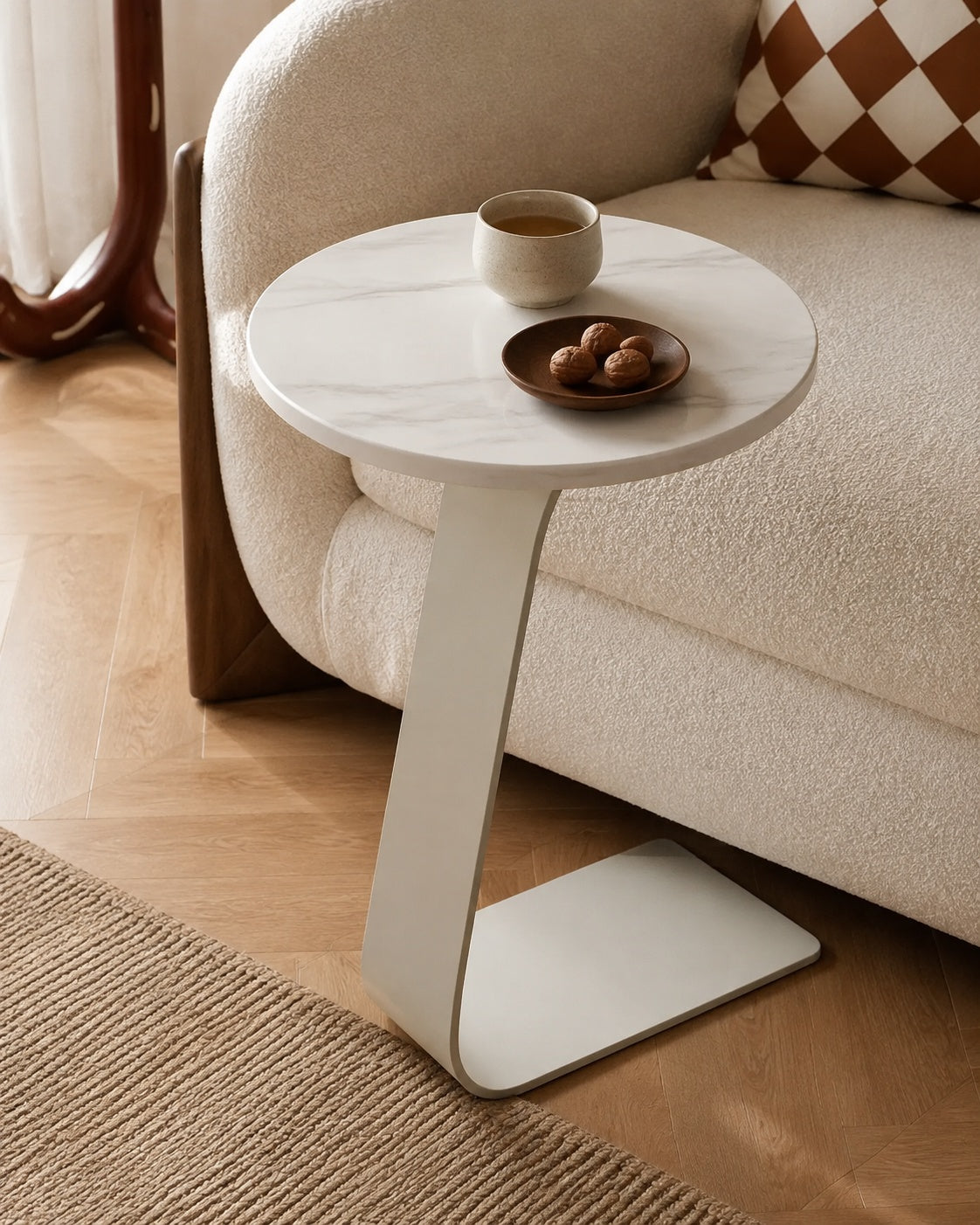 Snow White Sintered Stone tabletop and off-white C-shaped steel base detail