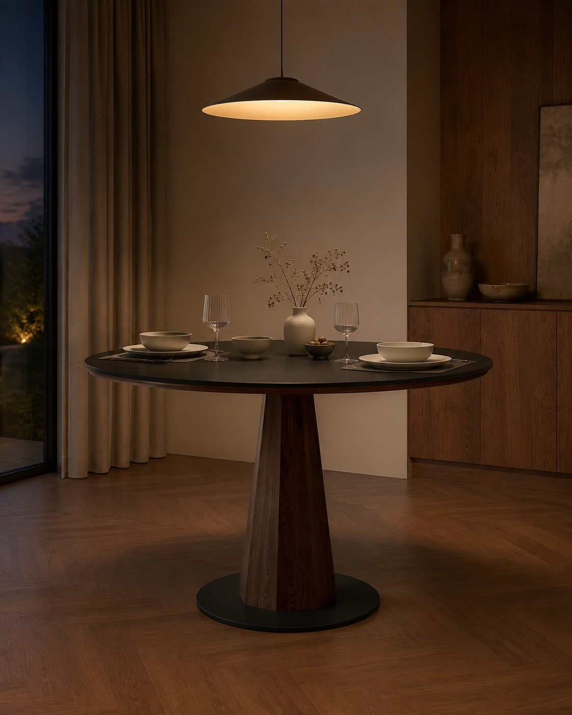 Walnut Sintered Stone Round Dining Table in an evening dining room