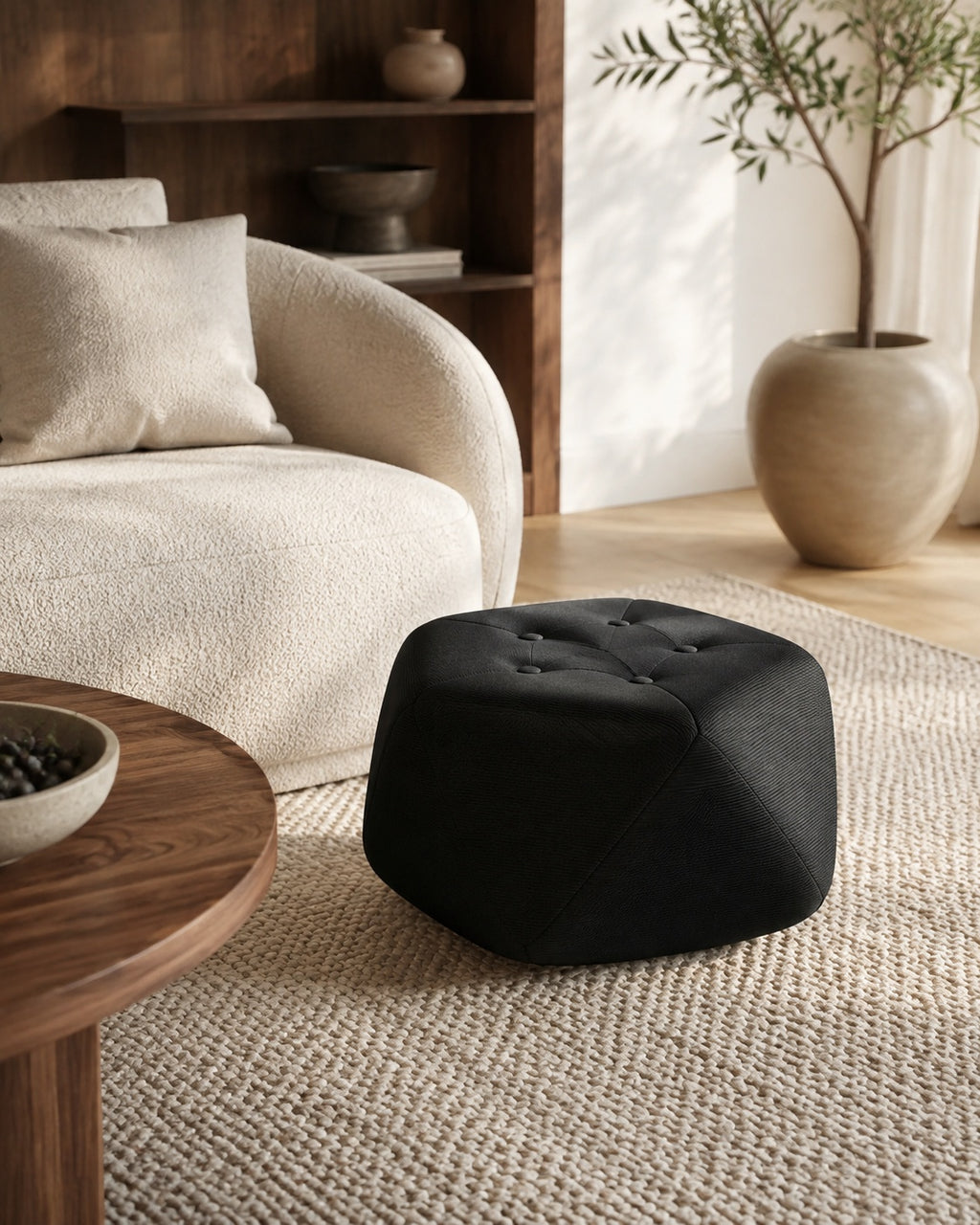 Black Four-Button Octagonal Upholstered Stool beside a Living Room Sofa